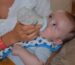 Baby wearing a bandana bib