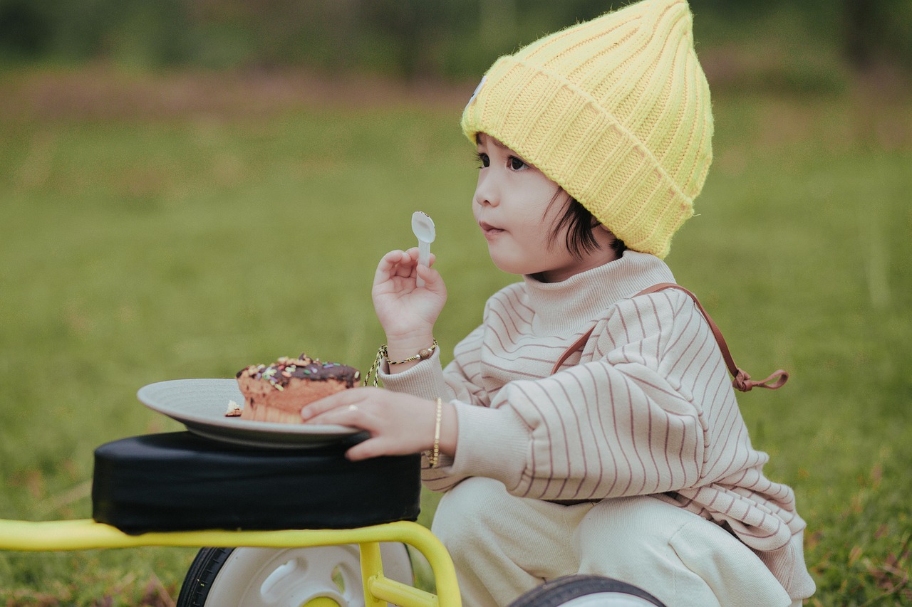 Baby in a high chair wearing a feeding bib