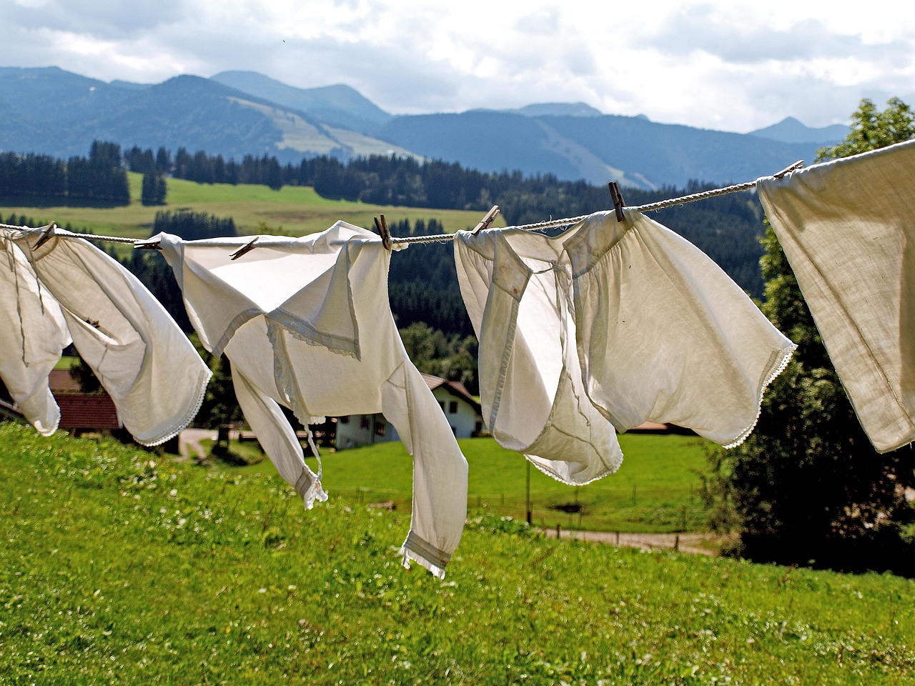 Baby bibs drying on a rack